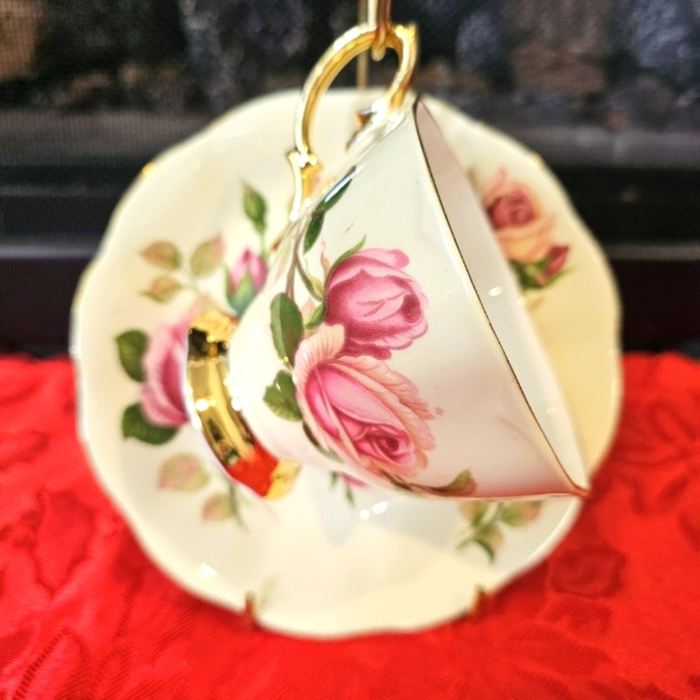 The Royal Albert "English Beauty" tea cup and saucer set features a delicate des